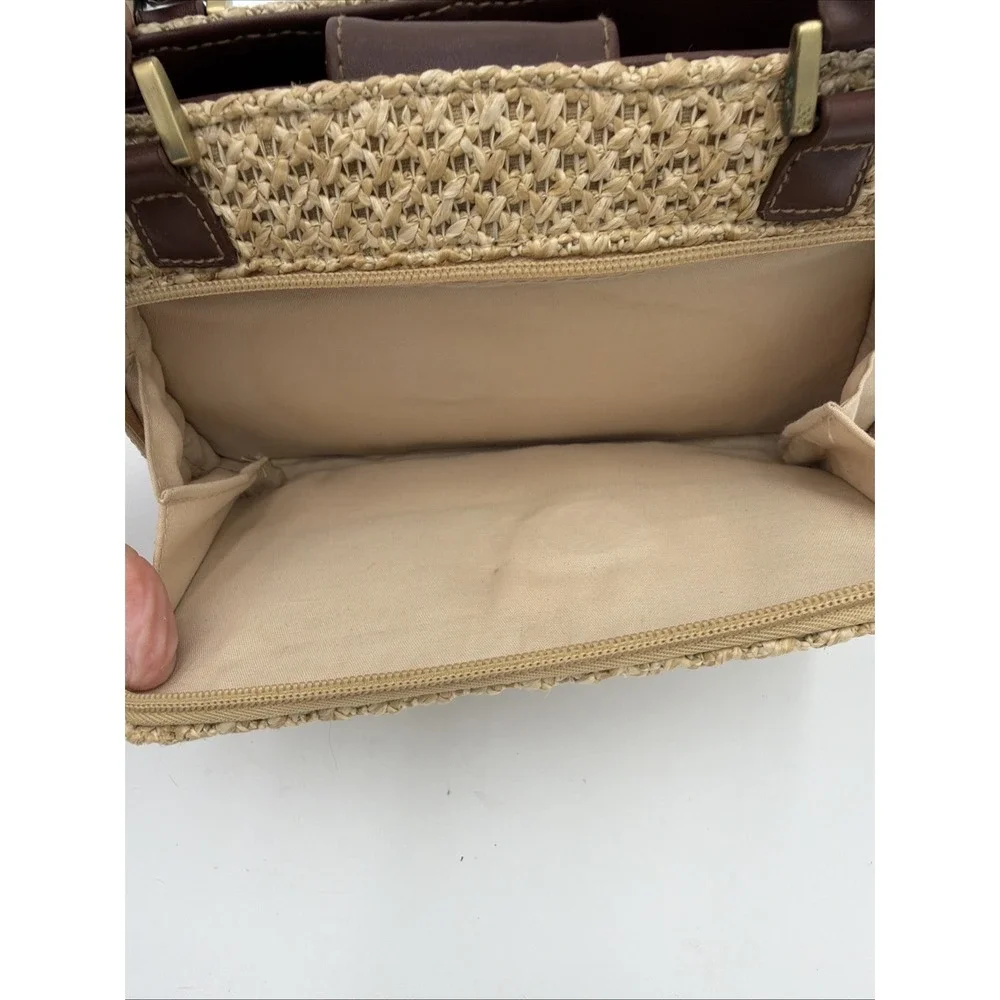 Rosetti straw tote handbag with brown faux leather trim‎ and top handles.